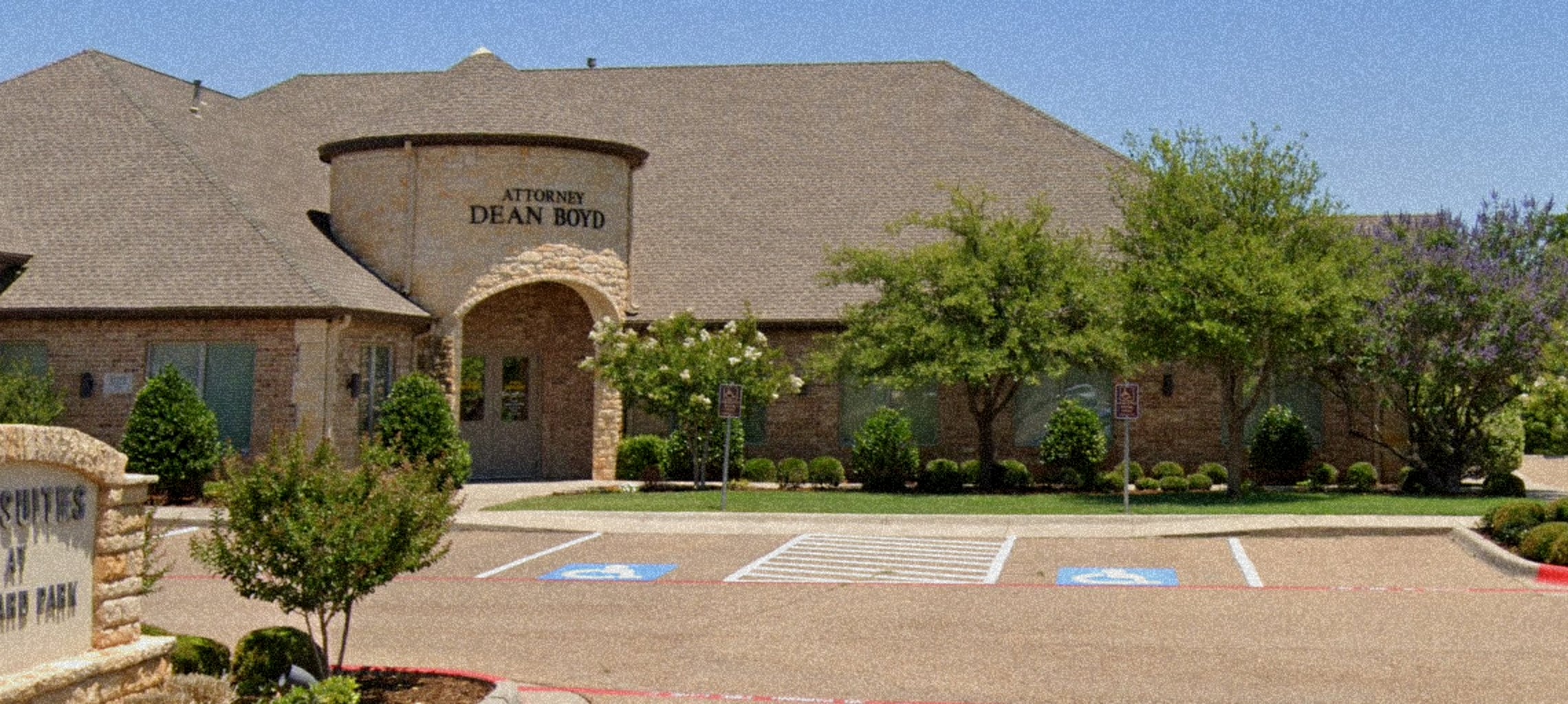 Attorney Dean Boyd Lubbock Office building exterior with parking lot.